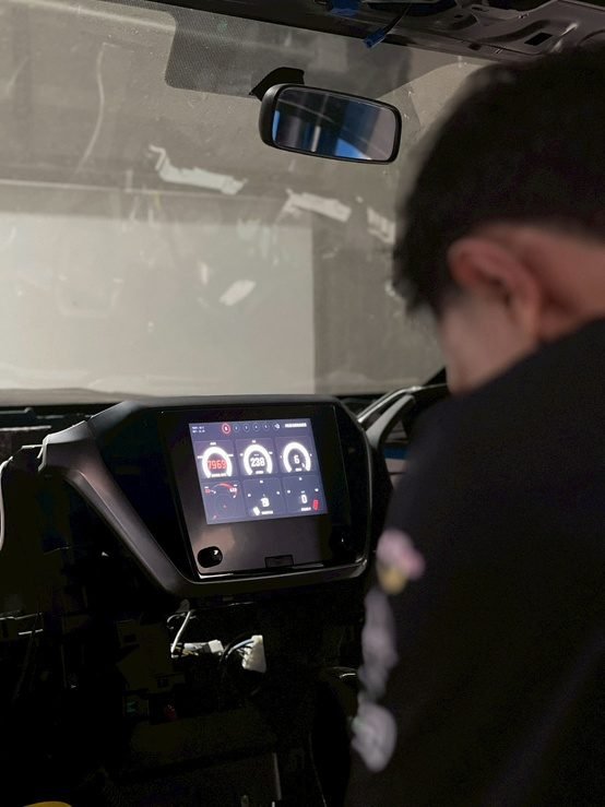 ELG engineer working beside a deployed in-vehicle system